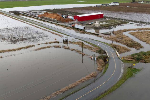 December 11, 2025, Vancouver, Bc, CANADA: A building surrounded by water is pictured in Abbotsford B.C., on Thursday, December 11, 2025. Vancouver CANADA  - ZUMAc35_ 20251211_zaf_c35_066 Copyright: xEthanxCairnsx