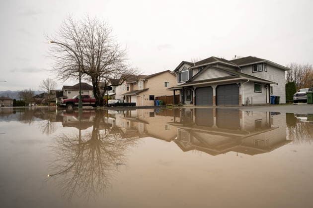 December 11, 2025, Vancouver, Bc, CANADA: Floodwaters surround houses in Abbotsford B.C., on Thursday, December 11, 2025. Vancouver CANADA  - ZUMAc35_ 20251211_zaf_c35_109 Copyright: xEthanxCairnsx