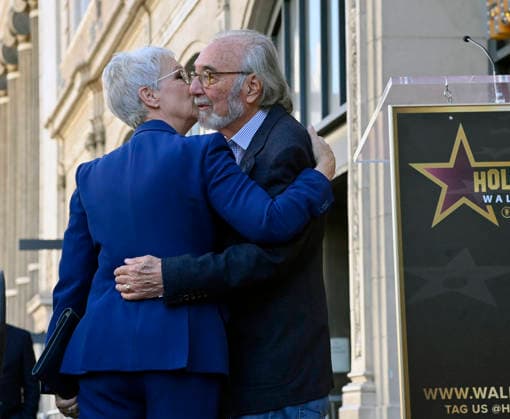 Director, producer and screenwriter James L. Brooks is joined by Jamie Lee Curtis during an unveiling ceremony honoring him with the 2,830th star on the Hollywood Walk of Fame in Los Angeles on Thursday December 11, 2025.  LAP2025121109 JIMxRUYMEN