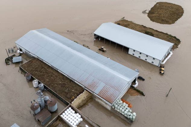 December 11, 2025, Vancouver, Bc, CANADA: Floodwaters surround barns in Abbotsford B.C., on Thursday, December 11, 2025. Vancouver CANADA  - ZUMAc35_ 20251211_zaf_c35_145 Copyright: xEthanxCairnsx