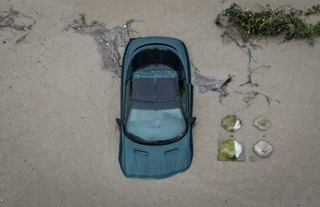 December 11, 2025, Abbotsford, Bc, CANADA: Floodwaters surround a vehicle in Abbotsford, B.C., on Thursday, December 11, 2025. Abbotsford CANADA  - ZUMAc35_ 20251211_zaf_c35_156 Copyright: xEthanxCairnsx
