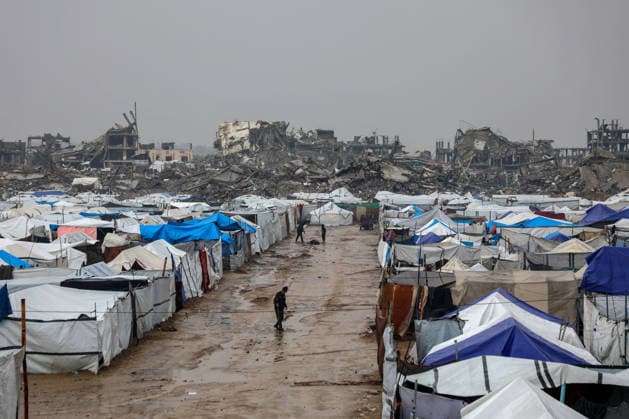 (251211) -- GAZA, Dec. 11, 2025 -- Photo taken on Dec. 11, 2025 shows shelters of displaced Palestinians in the Zeitoun neighborhood, southeast of Gaza City. Heavy winter rains and high winds are pounding flimsy temporary shelters of tents and tarps in the Gaza Strip, putting more vulnerable people at risk, UN humanitarians said on Wednesday. (Photo by Xinhua) MIDEAST-GAZA CITY-RAIN RizekxAbdeljawad 
