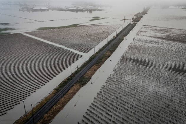 December 12, 2025, Abbotsford, Bc, CANADA: Floodwaters surround train tracks in Abbotsford, B.C., Friday, Dec. 12, 2025. Abbotsford CANADA  - ZUMAc35_ 20251212_zaf_c35_051 Copyright: xEthanxCairnsx