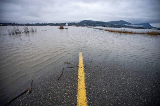 December 12, 2025, Abbotsford, Bc, CANADA: A flooded street is pictured in Abbotsford, B.C., on Friday, Dec. 12, 2025. Abbotsford CANADA  - ZUMAc35_ 20251212_zaf_c35_070 Copyright: xEthanxCairnsx