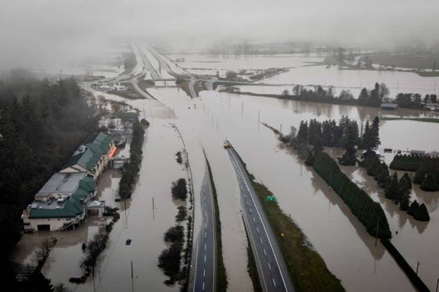December 12, 2025, Abbotsford, Bc, CANADA: Highway 1 is pictured covered by floodwaters in Abbotsford, B.C., on Friday, Dec. 12, 2025. Abbotsford CANADA  - ZUMAc35_ 20251212_zaf_c35_076 Copyright: xEthanxCairnsx