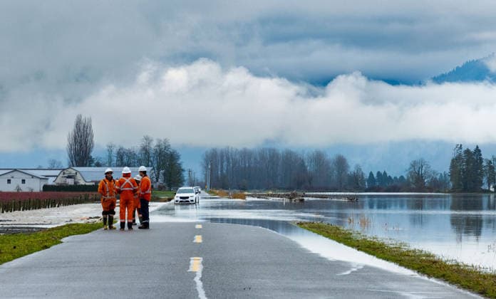(251213) -- ABBOTSFORD, Dec. 13, 2025 -- This photo provided by the shows a section of road flooded by rising water in Abbotsford, British Columbia, Canada, Dec. 12, 2025. ( Handout via Xinhua) CANADA-ABBOTSFORD-FLOODING GovernmentxofxBritishxColumbia 