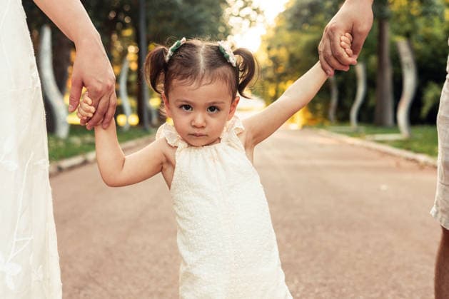 Family bonding during walk on a sunny day in park A family strolls through a sunlit park, holding hands and connecting with nature. The joyful moment captures the warmth of togetherness and the beauty of a bright day. Model Released AlinaKandybka_ID31612_1074787_026 Copyright: xAlinaxKandybkax RECORD DATE NOT STATED