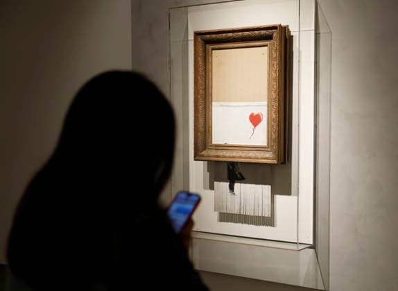 Banksy s Girl without Balloon (2018), the only artwork ever created live in an auction room, is on display at a preview of Icons: Back to Madison at Sotheby s in New York City on Saturday, December 13, 2025. Icons: Back to Madison inaugurates the new global headquarters at the Breuer Building and brings together some of the most iconic works ever sold at Sotheby s.  NYP20251213130 JOHNxANGELILLO