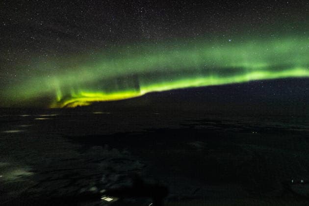 RUSSIA, MOSCOW REGION - DECEMBER 14, 2025: The northern lights are captured during the peak of the Geminid meteor shower. The Astro Night project, supported by Roscosmos, launched a special observation flight over the Moscow Region overnight from 13 to 14 December to observe the night sky phenomena from 10,000 metres. Sergei Savostyanov TASS  86456174