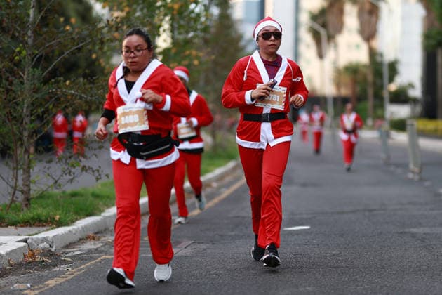 The 2025 Santa Run race in Mexico City MEXICO CITY, MEXICO - DECEMBER 14: People dressed in Santa Claus costumes participate in the Santa Run race, at La Mexicana Park, in Mexico City, Mexico on December 14, 2025. Hundreds of people dressed as Santa Claus, some accompanied by their dogs, gathered at La Mexicana Park for the annual 5 km and 10 km Santa Run races. Daniel Cardenas Anadolu Mexico City Mexico. Editorial use only. Please get in touch for any other usage.  Copyright: x2025xAnadoluxDanielxCardenasx