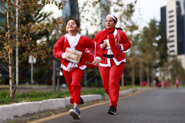 The 2025 Santa Run race in Mexico City MEXICO CITY, MEXICO - DECEMBER 14: People dressed in Santa Claus costumes participate in the Santa Run race, at La Mexicana Park, in Mexico City, Mexico on December 14, 2025. Hundreds of people dressed as Santa Claus, some accompanied by their dogs, gathered at La Mexicana Park for the annual 5 km and 10 km Santa Run races. Daniel Cardenas Anadolu Mexico City Mexico. Editorial use only. Please get in touch for any other usage.  Copyright: x2025xAnadoluxDanielxCardenasx