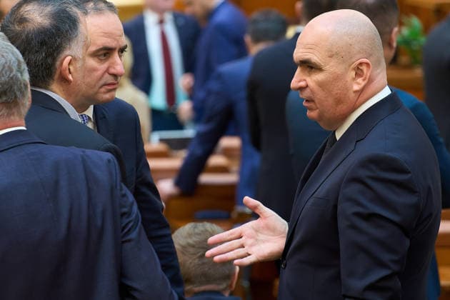 No-Confidence Motion Against Romanian Government, Bucharest, Romania Bucharest, Romania. 16th Dec, 2025: Romanian Prime Minister Ilie Bolojan (R) speaks to Alexandru Nazare (L), Romanian Minister of Finance, during the vote of the no-confidence motion against the Bolojan government filed by PACE - Romania First Group and Alliance for the Union of Romanians (AUR) during the joint plenary of the Chambers of the Romanian Parliament Bucharest Romania Copyright: xLucianxAlecux