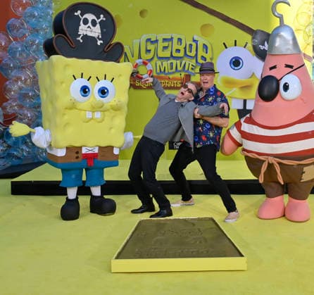 Tom Kenny, the voice of SpongeBob (L) and and Bill Fagerbake, the voice of Patrick participate in a hand and footprint ceremony immortalizing SpongeBob in the forecourt of the TCL Chinese Theatre (formerly Grauman s) in the Hollywood section of Los Angeles on Tuesday, December 16, 2025.  LAP20251216410 JIMxRUYMEN
