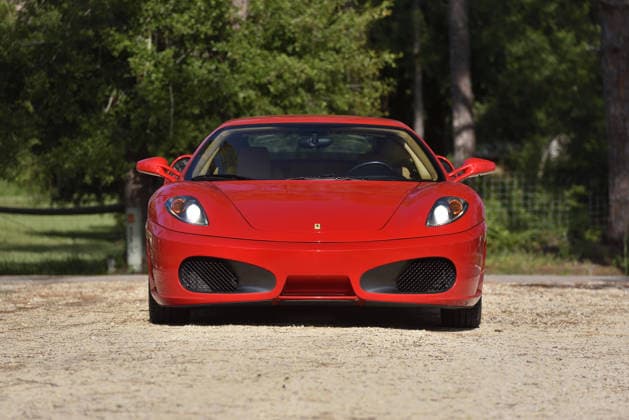 Donald Trump’s old Ferrari selling for £750,000 Story From Jam Press (Donald Trump Ferrari) Pictured: Donald Trump’s 2007 Ferrari F430 F1. Donald Trump’s old Ferrari selling for £750,000 Donald Trump’s old Ferrari is being sold for £750,000. The US President got the classic red F430 F1 brand new in 2007. It was ten years before he was elected to the White House. He was hosting the US version of The Apprentice at the time. It would have set him back about £120,000 when he got it 18 years ago. The 196mph supercar was delivered to the now 79-year-old Trump Tower in New York City. The car is being sold with Trump’s distinctive signature on the paperwork. The Ferrari boasts a 4.3 litre V8 engine and has only done 9,493 miles. The car  Copyright: xJamxPress PhotosxCourtesyxofxMecumxAuctions,xInc.