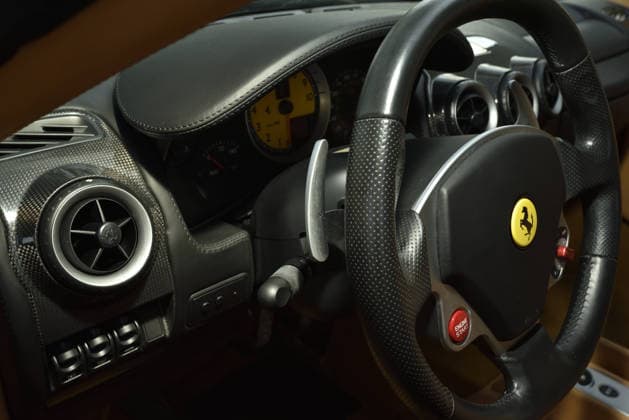 Donald Trump’s old Ferrari selling for £750,000 Story From Jam Press (Donald Trump Ferrari) Pictured: Inside Donald Trump’s 2007 Ferrari F430 F1. Donald Trump’s old Ferrari selling for £750,000 Donald Trump’s old Ferrari is being sold for £750,000. The US President got the classic red F430 F1 brand new in 2007. It was ten years before he was elected to the White House. He was hosting the US version of The Apprentice at the time. It would have set him back about £120,000 when he got it 18 years ago. The 196mph supercar was delivered to the now 79-year-old Trump Tower in New York City. The car is being sold with Trump’s distinctive signature on the paperwork. The Ferrari boasts a 4.3 litre V8 engine and has only done 9,493 miles. T  Copyright: xJamxPress PhotosxCourtesyxofxMecumxAuctions,xInc.