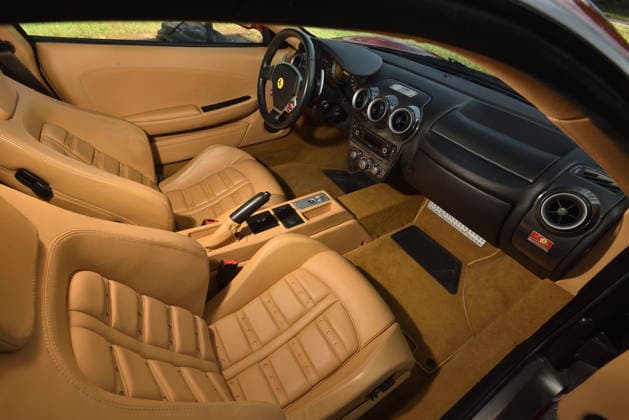 Donald Trump’s old Ferrari selling for £750,000 Story From Jam Press (Donald Trump Ferrari) Pictured: Inside Donald Trump’s 2007 Ferrari F430 F1. Donald Trump’s old Ferrari selling for £750,000 Donald Trump’s old Ferrari is being sold for £750,000. The US President got the classic red F430 F1 brand new in 2007. It was ten years before he was elected to the White House. He was hosting the US version of The Apprentice at the time. It would have set him back about £120,000 when he got it 18 years ago. The 196mph supercar was delivered to the now 79-year-old Trump Tower in New York City. The car is being sold with Trump’s distinctive signature on the paperwork. The Ferrari boasts a 4.3 litre V8 engine and has only done 9,493 miles. T  Copyright: xJamxPress PhotosxCourtesyxofxMecumxAuctions,xInc.
