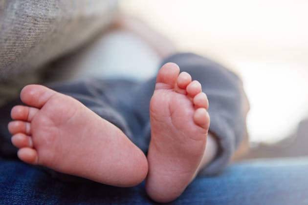 Mother, baby and feet with growth in home for childhood development, comfort or newborn skin. Mom, closeup and foot with toes of infant, child or kid for break, rest or bonding together in house. model released property released Copyright: xx