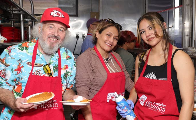19 December 2025 - Los Angeles, California - Clint Howard, Kat Howard and Rafa ella Erlinda Hope The Mission And Los Angeles Mission Host Annual Christmas Celebration On Skid Row held at Los Angeles Mission in Los Angeles. Los Angeles USA - ZUMAa123 20251219_zaa_a123_146 Copyright: xADx