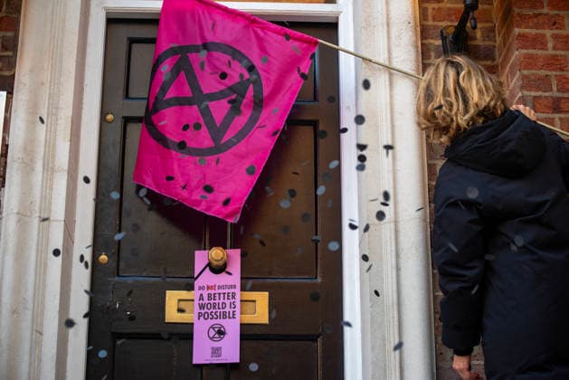December 20, 2025, London, United Kingdom: Protesters left a hotel door tag on the door with confetti outside the 55 Tufton Street (it is owned by a right-wing climate skeptical lobby group) during the rally. Extinction Rebellion campaigners called on political leaders for failing to meet climate commitments, in central London, UK. Because of the government inaction over 1.5-degree target. The 1.5-degree target is the climate goal of limiting the man-made global temperature increase caused by the greenhouse effect. London United Kingdom - ZUMAs197 20251220_aaa_s197_105 Copyright: xKrisztianxElekx