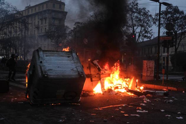 December 20, 2025, Turin, Piedmont, Italy: In Turin, on December 20, thousands of demonstrators protest against the eviction of the Askatasuna social center, which has been active for thirty years. The march attempts to reach the building but encounters a massive deployment of police forces who use tear gas and water cannons to disperse the crowd. Garbage cans, used as barricades, catch fire. The march then continues, while the organizers promise new demonstrations in the coming weeks. Turin Italy - ZUMAs377 20251220_znp_s377_002 Copyright: xPietroxStariccox