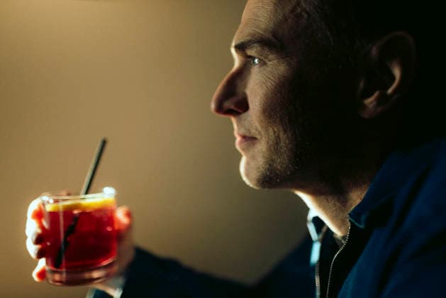 Close-up of thoughtful man holding glass of drink Sweden, Stockholm, model released, property released Copyright: xMaskotx , MA121942 MA121942