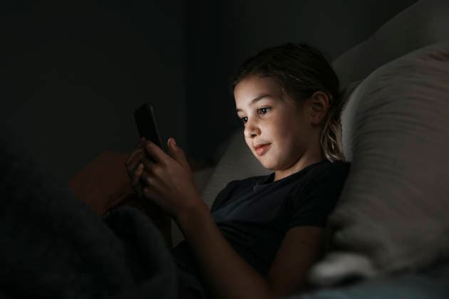 Girl using smart phone in bedroom at night Sweden, Stockholm, model released, property released Copyright: xMaskotx , MA122155 MA122155