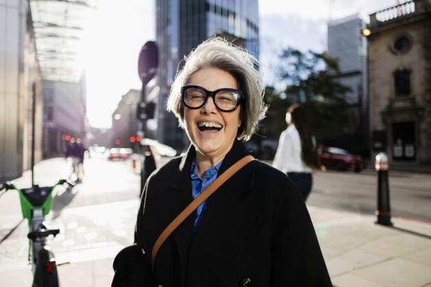 Laughing woman with gray hair and glasses outdoors in urban city model released, Symbolfoto, ASGF07364