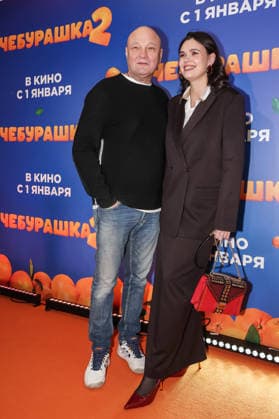 RUSSIA, MOSCOW - DECEMBER 24, 2025: Actor, producer, director Sergei Ginzburg poses with his wife Olga Vinichenko on the red carpet during the premiere of the family comedy Cheburashka 2 by Dmitry Dyachenko at the KARO 11 Oktyabr cinema on Novy Arbat Street (New Arbat Avenue). Valery Sharifulin TASS  86692234