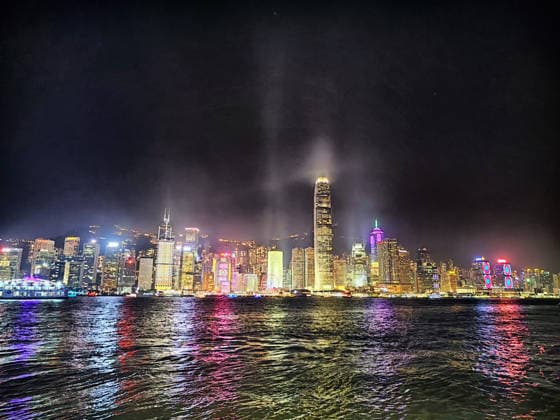 RECORD DATE NOT STATED Hong Kong, China - April 11, 2024: Night view of Hong Kong skyline with vibrant lights reflecting on the water during a memorable travel trip Hong Kong, China - April 11, 2024: The stunning Hong Kong skyline showcases colorful lights shimmering on the water at night, creating a captivating travel experience., 96623964.jpg