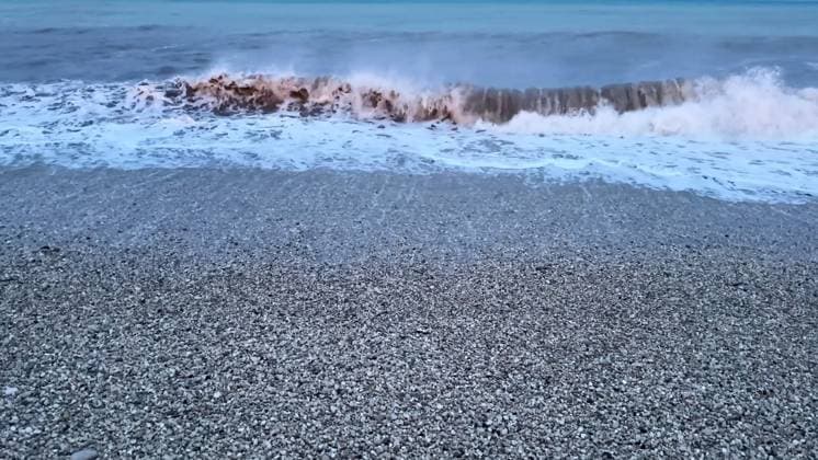 Creative Highlights World The calming waves gently lap against the shoreline during the beautiful twilight hours Immerse yourself in the serene and captivating beauty of gentle waves crashing against a pebbled beach during twilight, 96644192.jpg RECORD DATE NOT STATED