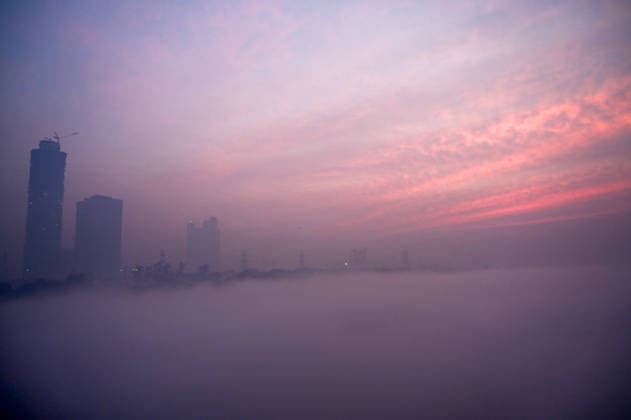 NOIDA, INDIA - DECEMBER 26: The view of the Yamuna River covered in dense fog early in the morning, near Kalindi Kunj on December 26, 2025 in Noida, India. (Photo by Sunil Ghosh Hindustan Times) Dense Early Morning Fog Engulfs Noida