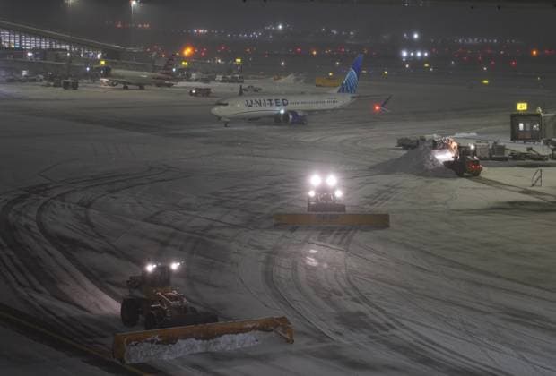 (251227) -- NEW YORK, Dec. 27, 2025 -- Snowplows clear snow at LaGuardia Airport in New York, the United States, on Dec. 26, 2025. A snowstorm hitting New York on Friday, which has caused flight delays and cancellations. ) U.S.-NEW YORK-SNOWSTORM-FLIGHTS-DISRUPTING ZhangxFengguo 