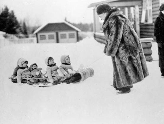 The Dionne quintuplets The Dionne Quintuplets have a thrilling sledge run . The Dionne Quintuplets had their first taste of the thrills of winter sport in the garden of their private hospital at Callender , Ontario , after several heavy snowfalls . Snugly wrapped up in their warm woollies the Quins were taken for a sledge ride by Dr A P Dafoe . Photo shows , Annette Dionne , one of the famous Quintuplets , wrestles with the problem of making snowballs with her hands pinned in her sleeves at Callender , Ontario . 19 April 1936, Credit:TopFoto Avalon Canada  Copyright: xTopFotox xAvalonx 0872529504
