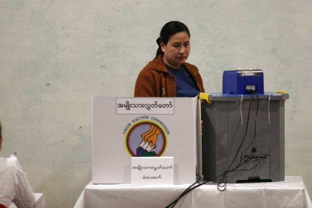 (251228) -- YANGON, Dec. 28, 2025 -- A voter uses an electronic voting machine to cast her ballot at a polling station in Yangon, Myanmar, Dec. 28, 2025. Myanmar kicked off its 2025 multi-party democratic general election with the first phase held on Sunday. The general election is scheduled to be held in three phases, with the second phase set for Jan. 11, 2026, followed by the third phase on Jan. 25. ) MYANMAR-YANGON-2025 GENERAL ELECTION-VOTING MyoxKyawxSoe 