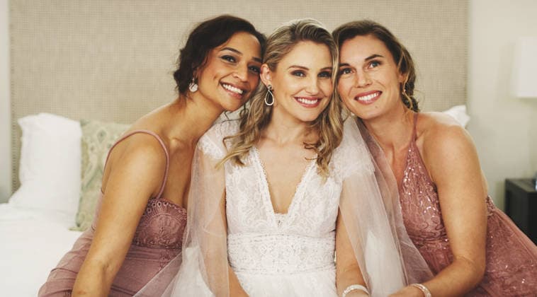 Bride, bridal party and portrait of women on wedding day with happiness, care and glamour on bed. Bridesmaids, hug and friends smile together for celebration, ceremony and support in dressing room Bride, bridal party and portrait of women on wedding day with happiness, care and glamour on bed. Bridesmaids, hug and friends smile together for celebration, ceremony and support in dressing room., model released, , property released, , 97752638.jpg RECORD DATE NOT STATED