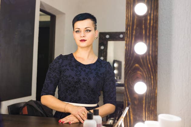 beautiful girl with short hair looking through the mirror in dressing room beautiful girl looking through the mirror in dressing room, model released, , 97817810.jpg RECORD DATE NOT STATED