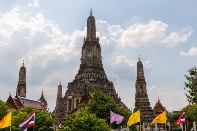 The stunning Wat Arun Temple beautifully stands against a vibrant sky in enchanting Thailand A breathtaking and stunning view of Wat Arun, showcasing its intricate architecture along with beautiful clouds, 97823896.jpg RECORD DATE NOT STATED