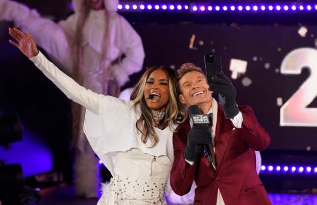 Ciara, American singer-songwriter and dancer, and Ryan Seacrest, American television host, (L to R), perform as thousands of revelers gather in Times Square to bring in the new year, in New York City on Wednesday, December 31, 2025. Crowds have gathered to watch the iconic ball drop from the skyscraper at One Times Square on New Year s for more than a century.  NYP20251231906 DEREKxFRENCH