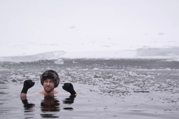 January 1, 2026, Dartmouth, Ns, Canada: A person stays still in the ice-filled water in Lake Banook during the annual polar bear swim on New Year s Day in Dartmouth, N.S., Thursday, Jan. 1, 2026. Dartmouth Canada  - ZUMAc35_ 20260101_zaf_c35_013 Copyright: xDarrenxCalabresex