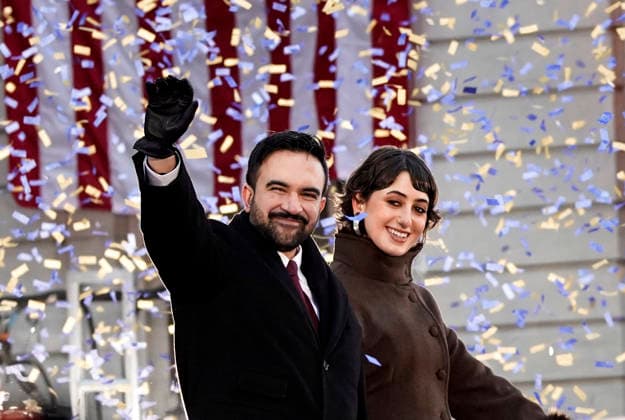 Zohran Mamdani and his wife, Rama Duwaji, wave after Mamdani s inauguration as mayor of New York City outside New York City Hall on Thursday, January 1, 2026. 34-year-old Mamdani is the city s first Muslim mayor and its youngest in more than a century.  NYC20260101343 BONNIExCASH