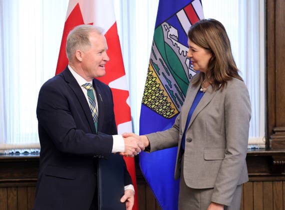 January 2, 2026, Calgary, Ab, Canada: Alberta MLA Grant Hunter, left, shakes hands with Alberta Premier Danielle Smith after being sworn-in as the new Minister of Environment and Protected Areas at McDougall Centre in Calgary on Friday, Jan. 2, 2026. Calgary Canada  - ZUMAc35_ 20260102_zaf_c35_005 Copyright: xGavinxYoungx