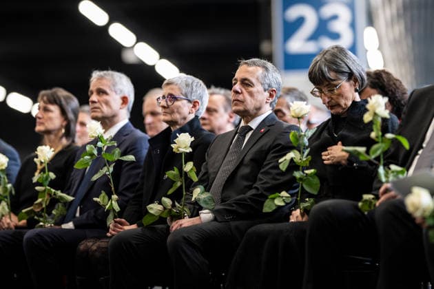 (260110) -- MARTIGNY, Jan. 10, 2026 -- Swiss Foreign Minister Ignazio Cassis (2nd R) attends the official memorial ceremony mourning the victims of a New Year s Eve bar fire in Martigny, Switzerland, Jan. 9, 2026. Switzerland held a national memorial service on Friday to mourn the victims of a deadly New Year s Eve bar fire in the resort town of Crans-Montana, as authorities continued their investigation into the incident. Due to forecasts of heavy snowfall in Crans-Montana, Swiss authorities decided to hold the official ceremony in Martigny, more than 50 kilometers west of the resort town, citing safety concerns. (Photo by Xinhua) SWITZERLAND-MARTIGNY-CRANS-MONTANA SKI RESORT BAR FIRE-MEMORIAL CEREMONY LouisxDasselborne 