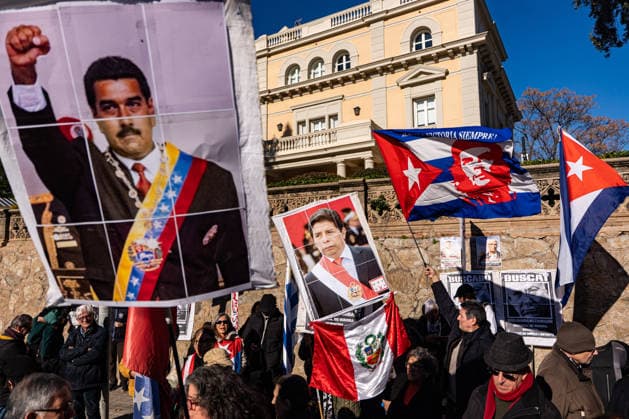 January 11, 2026, Barcelona, Barcelona, Spain: Around 150 people gathered this morning outside the United States Consulate in Barcelona to demand the release of NicoloÂ¡s Maduro and to defend the sovereignty of the Bolivarian Republic of Venezuela. They also displayed banners and flags with the faces of Maduro, Pedro Castillo, and Che Guevara. Barcelona Spain - ZUMAa239 20260111_zip_a239_010 Copyright: xMarcxAsensioxClupesx