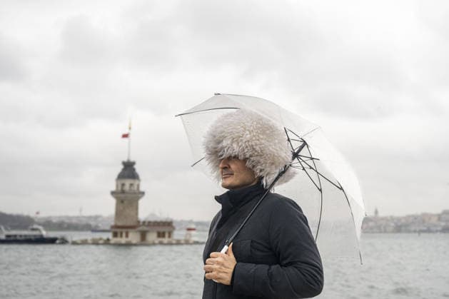 Heavy rain hit Istanbul ISTANBUL, TURKIYE - JANUARY 11: A man with an umbrella is seen near the Maiden’s Tower during heavy rain affected Uskudar Beach and the surrounding area in Istanbul, Turkiye on January 11, 2026. Fatma Nur Arslan Anadolu Istanbul Turkey. Editorial use only. Please get in touch for any other usage.  Copyright: x2026xAnadoluxFatmaxNurxArslanx