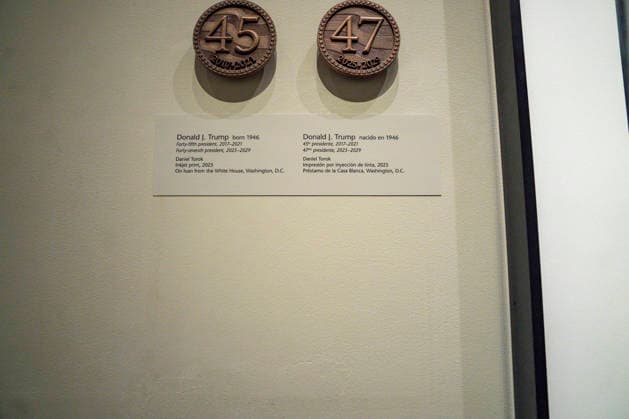 The portrait plaque accompanying a portrait of President Donald Trump is not on display at the Smithsonian National Portrait Gallery in Washington, DC on Monday, January 12, 2026. The museum removed reference to Trump s two impeachments during his first term from the accompanying portrait plaque when replacing their portrait of him in their America s Presidents exhibit.  WAP20260112424 BONNIExCASH