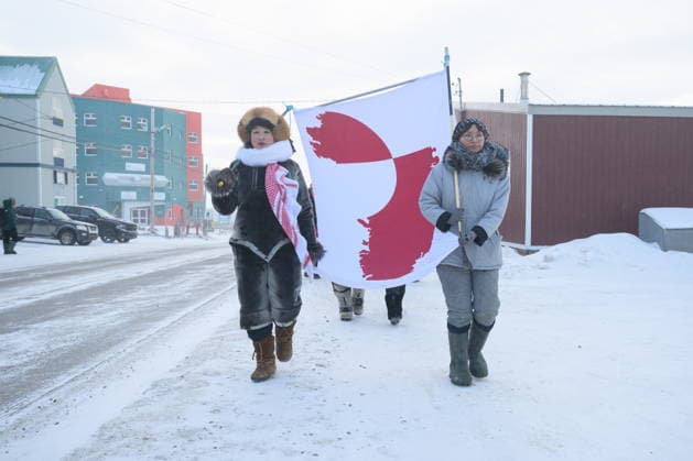 January 17, 2026, Iqaluit, Nu, Canada: Iqaluit residents, Laakkuluk Williamson Bathory and Siku Rojas hold a Greenlandic banner during a solidarity march through NunavutöÄÃ s capital on Saturday, Jan. 17, 2026. Iqaluit Canada  - ZUMAc35_ 20260117_zaf_c35_025 Copyright: xDustinxPatarx