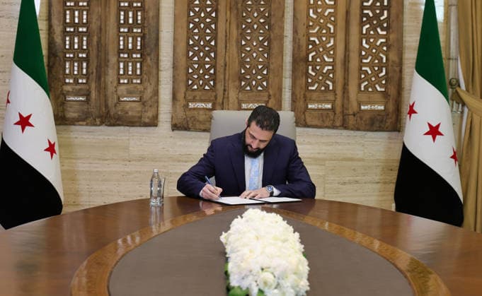 Syrian President Ahmed Sharaa signs ceasefire and integration agreement with YPG SDF DAMASCUS, SYRIA - JANUARY 18: (----EDITORIAL USE ONLY - MANDATORY CREDIT - SYRIAN PRESIDENCY HANDOUT - NO MARKETING NO ADVERTISING CAMPAIGNS - DISTRIBUTED AS A SERVICE TO CLIENTS----) Syrian President Ahmed Sharaa signed an agreement covering a ceasefire and the full integration of the YPG, operating under the name SDF (Syrian Democratic Forces) in Damascus, Syria on January 18, 2026. Syrian Presidency Anadolu Damascus Syria. Editorial use only. Please get in touch for any other usage.  Copyright: x2026xAnadoluxSyrianxPresidencyx