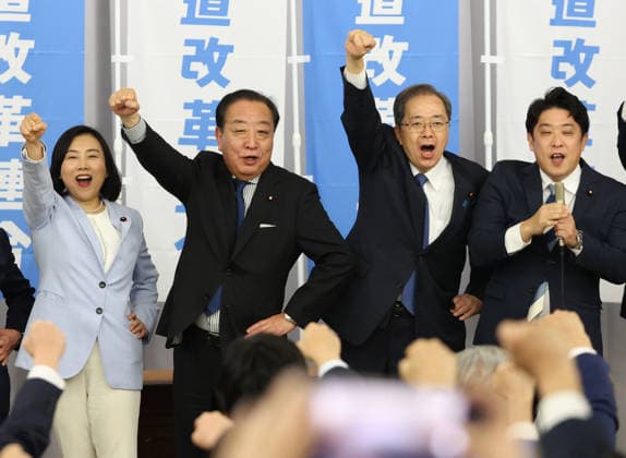 January 22, 2026, Tokyo, Japan - Japan s opposition Constitutional Democratic Party of Japan leader Yoshihiko Noda (C, L) and New Komei Party leader Tetsuo Saito (C, R) raise their fists in the air at the new party Centrist Reform Alliance launching event as the both leaders will become co-leaders of the new party in Tokyo on Thursday, January 22, 2026. Prime Minister Sanae Takaichi will disolve Lower House on January 23 and some 200 new party candidates will run for the general election. (photo by Yoshio Tsunoda AFLO)  aflo_316984358