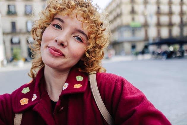 Smiling curly haired woman taking selfie model released, Symbolfoto, ASGF05909