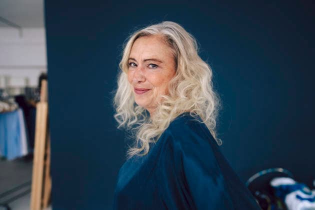 Confident mature businesswoman in blue blouse posing in loft model released, Symbolfoto property released, KNSF11545